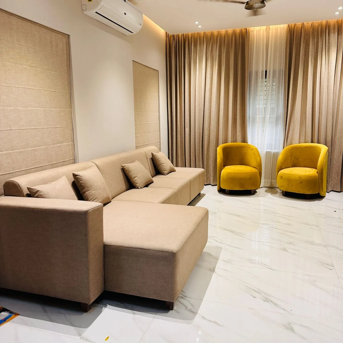 Completed living room with customised sofa and curtains by Loom Art